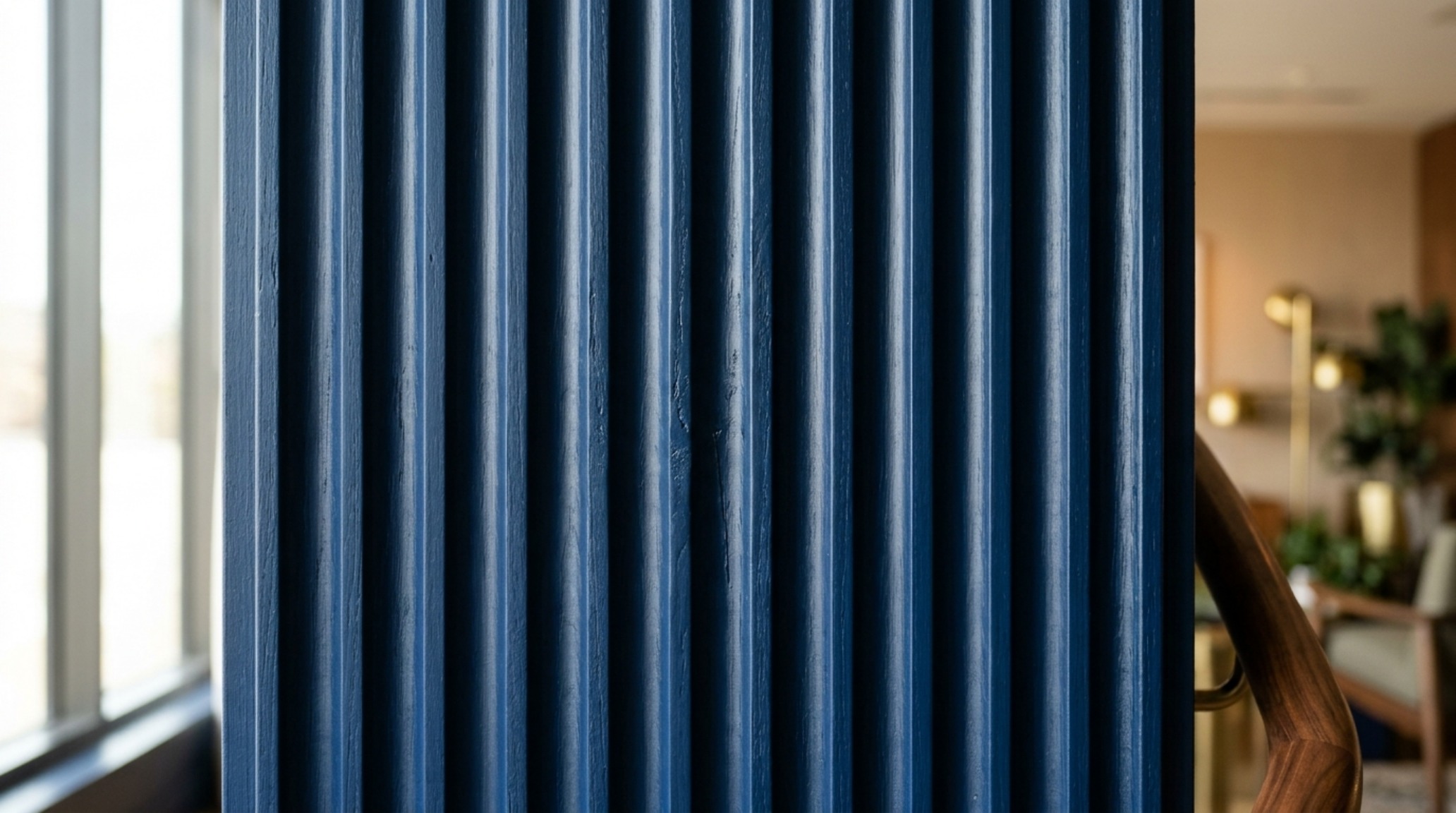 Architectural detail of crown molding and ceiling painted in a singular deep blue hue to remove visual boundaries. Architectural detail of crown molding and ceiling painted in a singular deep blue hue to remove visual boundaries.