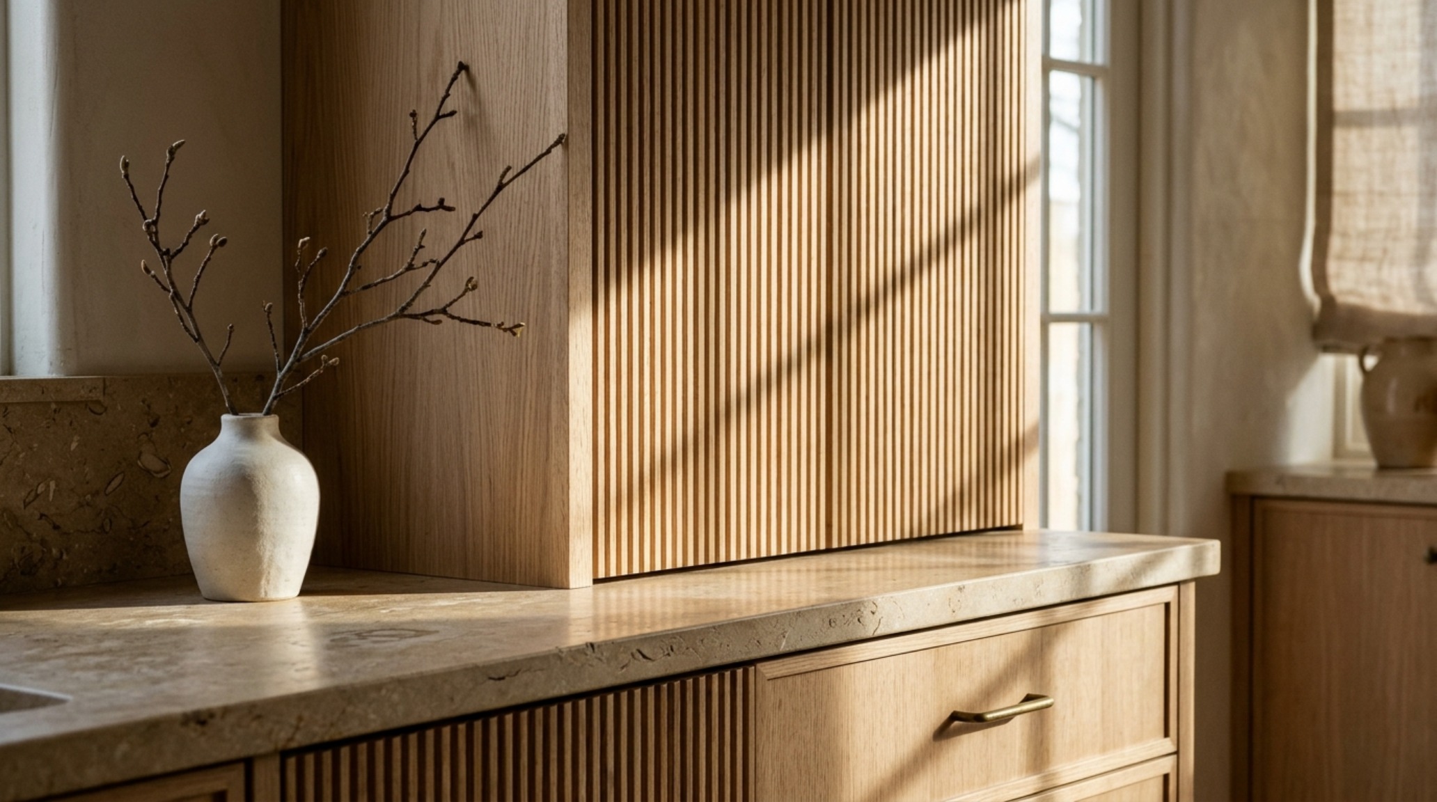 modern country kitchen ideas capturing the play of natural light on a fluted oak cabinet face and stone countertops. modern country kitchen ideas capturing the play of natural light on a fluted oak cabinet face and stone countertops.