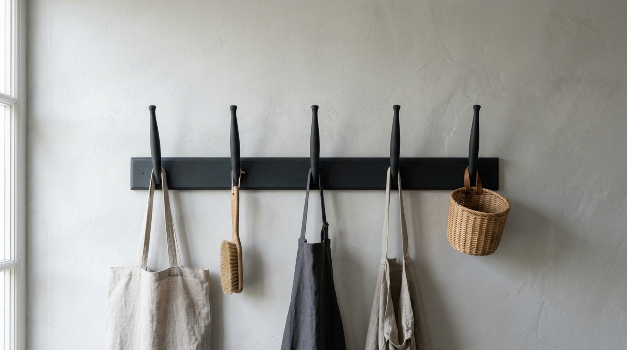 modern shaker peg rail dimensions reimagined in a monochromatic charcoal finish with elongated tapered pegs for a minimalist mudroom modern shaker peg rail dimensions reimagined in a monochromatic charcoal finish with elongated tapered pegs for a minimalist mudroom