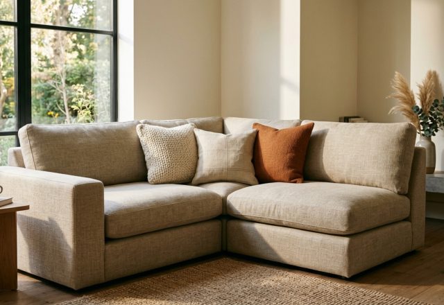 how to arrange pillows on a sectional featuring a 24-inch anchor pillow in a deep corner with 90/10 down fill and Belgian linen upholstery