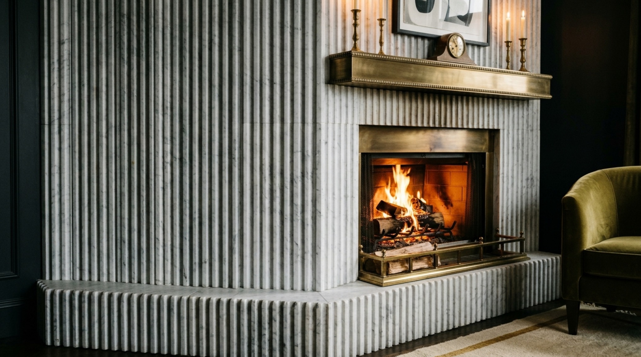 Luxury corner stone fireplace textures of fluted marble slabs creating a rhythmic architectural focal point in a high-end residential lounge. Luxury corner stone fireplace textures of fluted marble slabs creating a rhythmic architectural focal point in a high-end residential lounge.