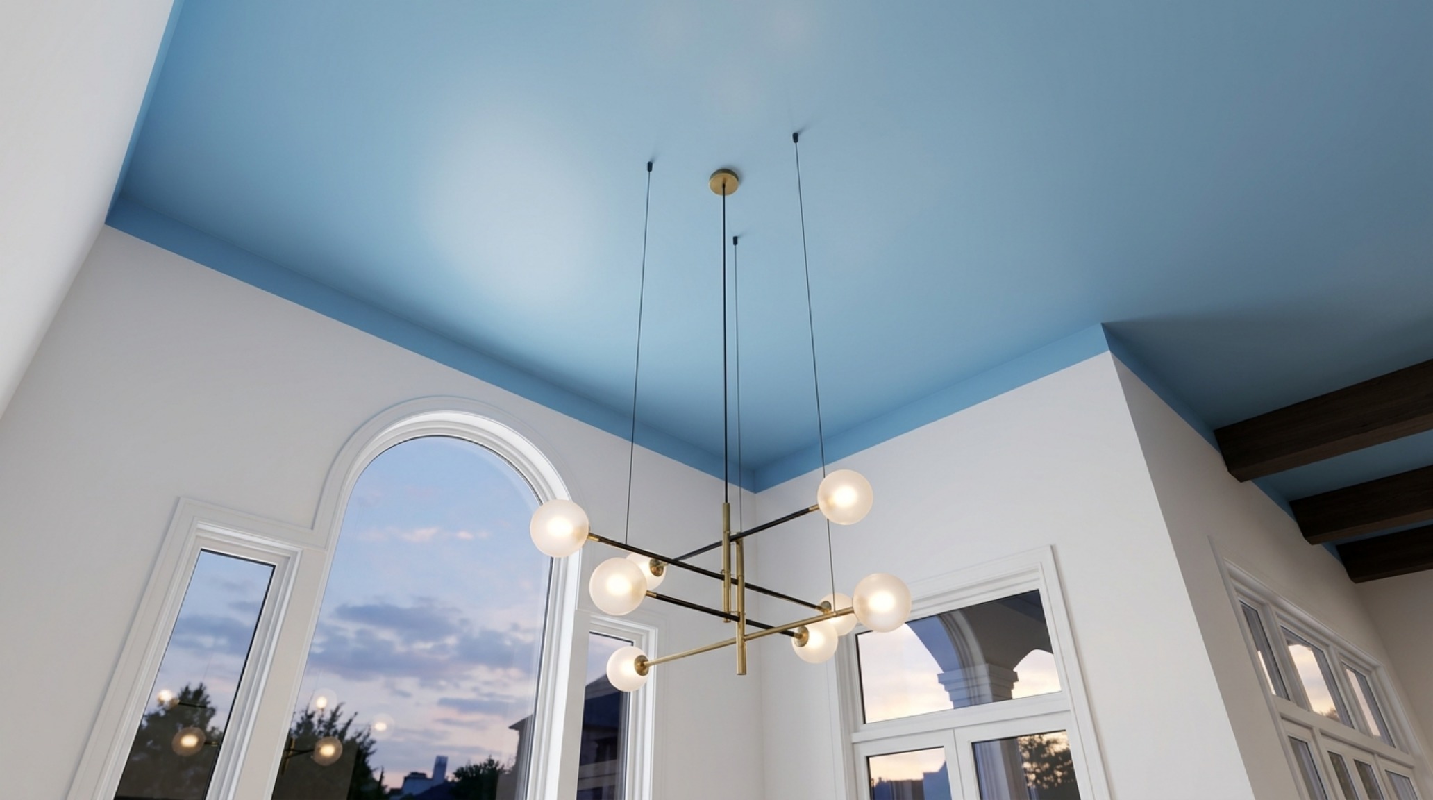 Architectural detail of a ceiling 'fifth wall' treatment, showing how a continuous paint color can expand a 12-foot wide room's perceived height.