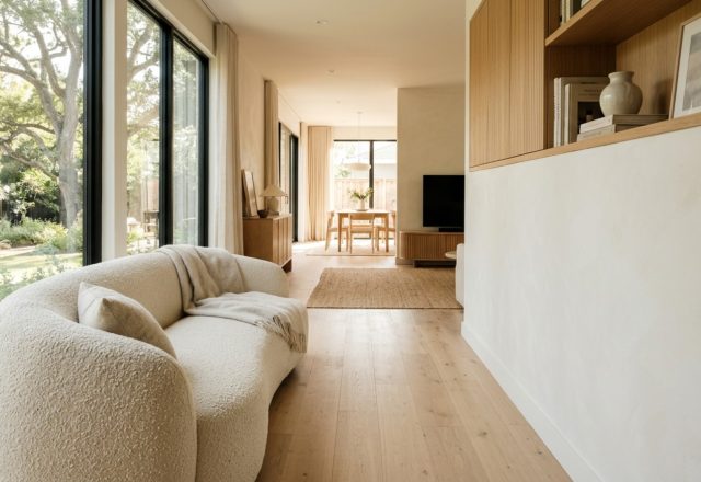 Wide-angle architectural view of a living room showcasing 36-inch walkway clearances and a balanced 3d living room designer layout with soft natural sunlight.