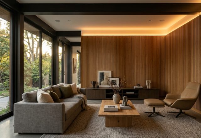 modern wall panels interior design ideas featuring vertical oak slats and integrated warm 2700K LED grazing lights in a minimalist living room.