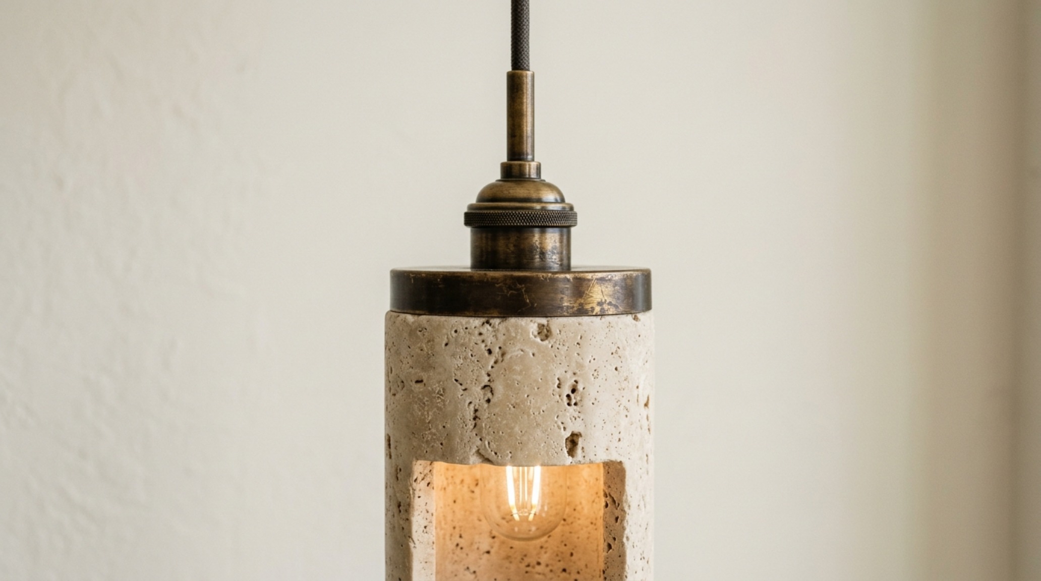 luxury unique hanging lights textures showcasing honed travertine stone pendants against a Benjamin Moore Swiss Coffee wall luxury unique hanging lights textures showcasing honed travertine stone pendants against a Benjamin Moore Swiss Coffee wall