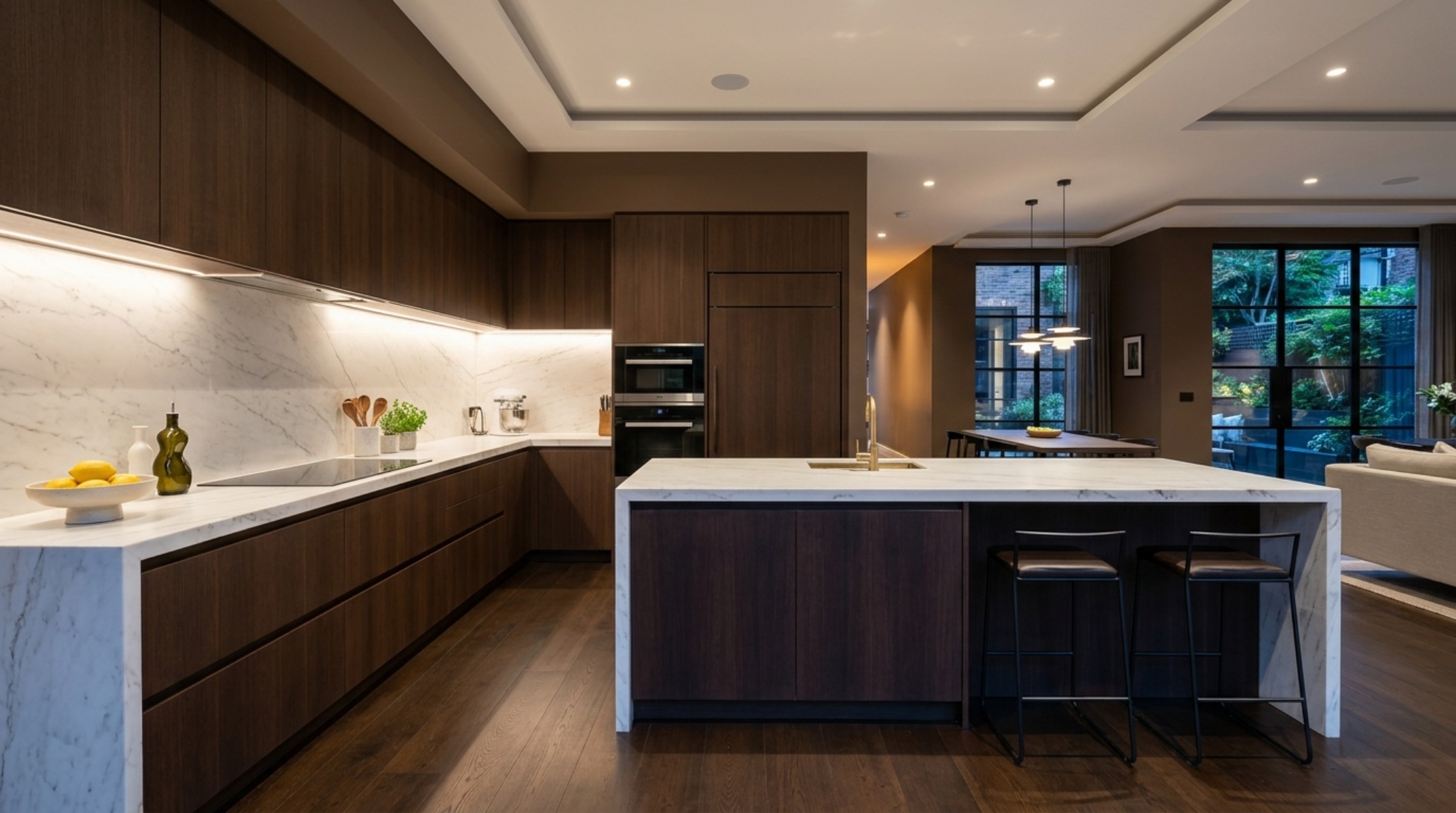 Luxury kitchen featuring dark cocoa cabinetry and paint color browns 0608 decor ideas architecture with integrated high-end appliances and marble backsplashes.
