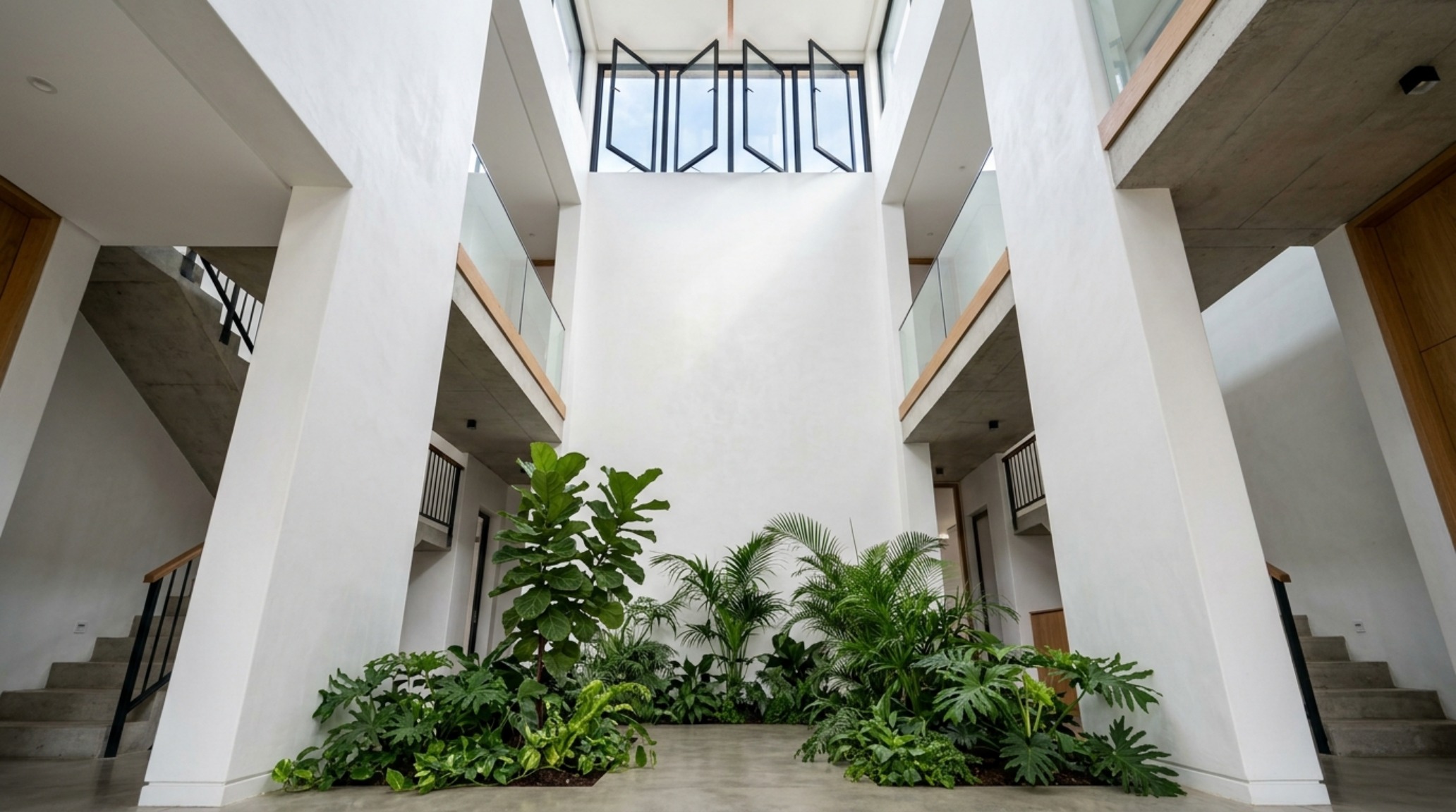 thermal chimneys design with a double-height atrium and operable clerestory windows for passive cooling