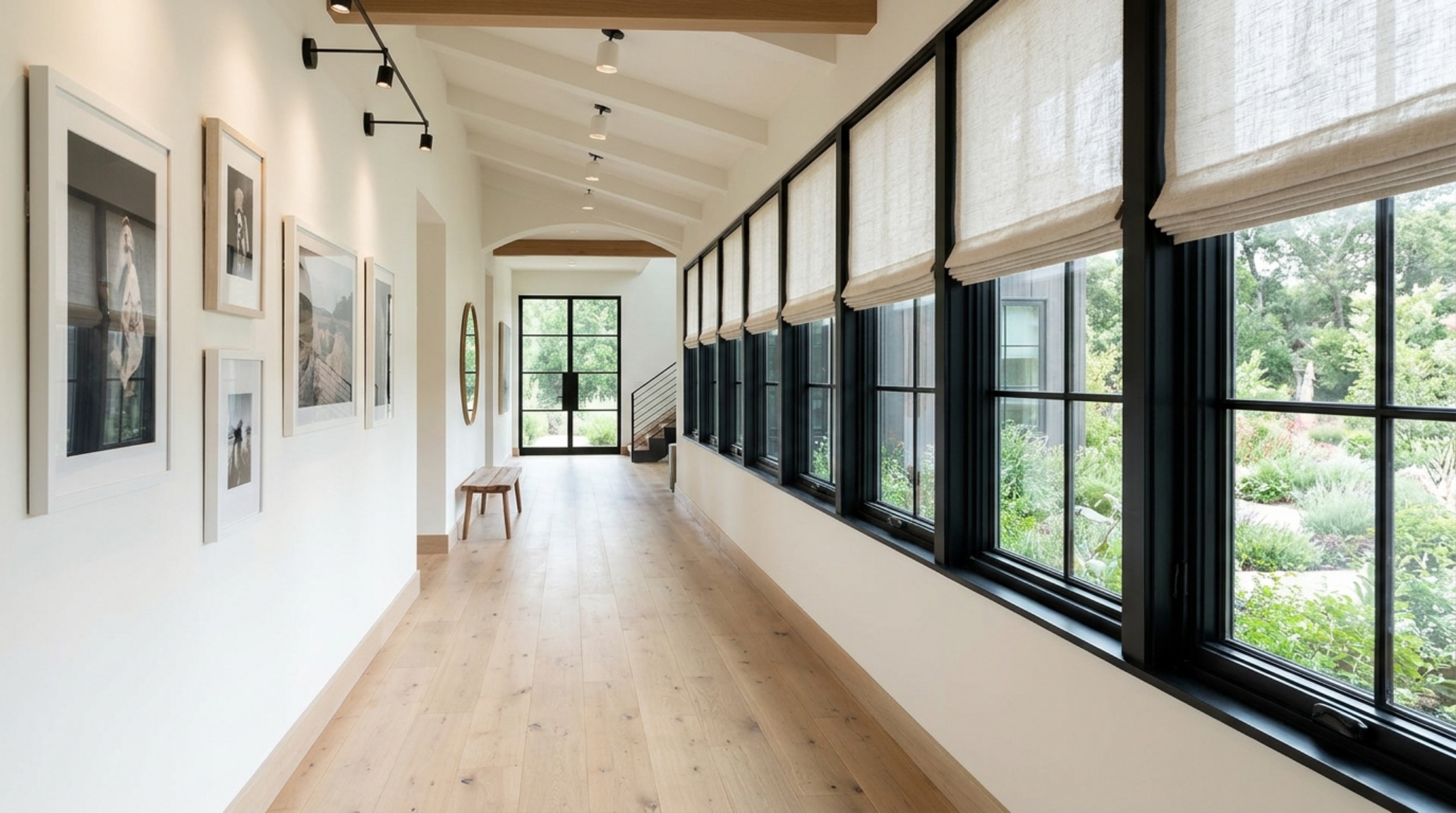Perspective view of a long hallway with consistent black window hardware showcasing farmhouse fresh how window treatments set decor ideas across the home.