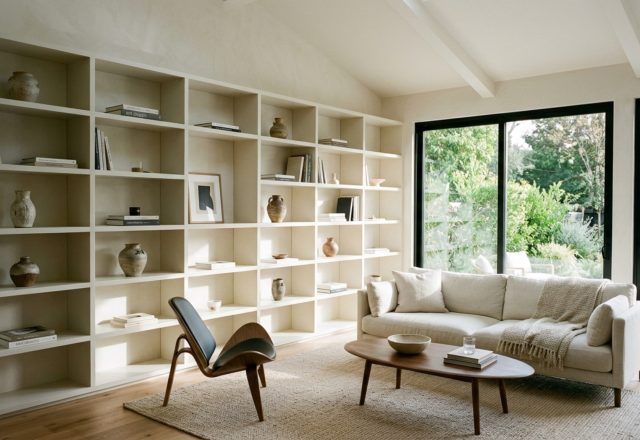 Modern ideas for shelving ideas featuring a floor-to-ceiling minimalist library in Benjamin Moore Swiss Coffee with seamless shadow gaps and curated art objects.