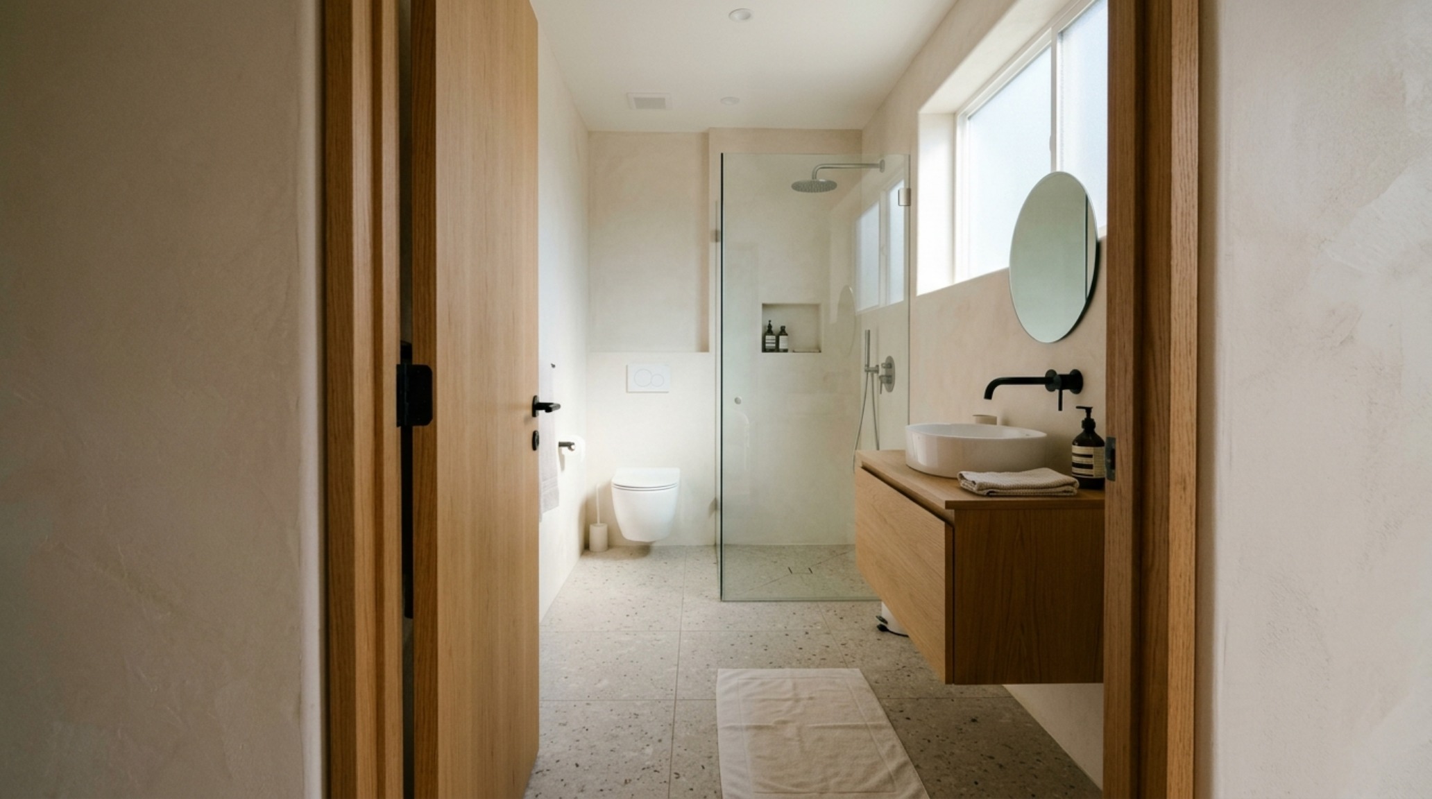 ideas for small bathrooms featuring a 32-inch clear walkway and a space-saving pocket door entrance in a neutral minimalist palette. ideas for small bathrooms featuring a 32-inch clear walkway and a space-saving pocket door entrance in a neutral minimalist palette.