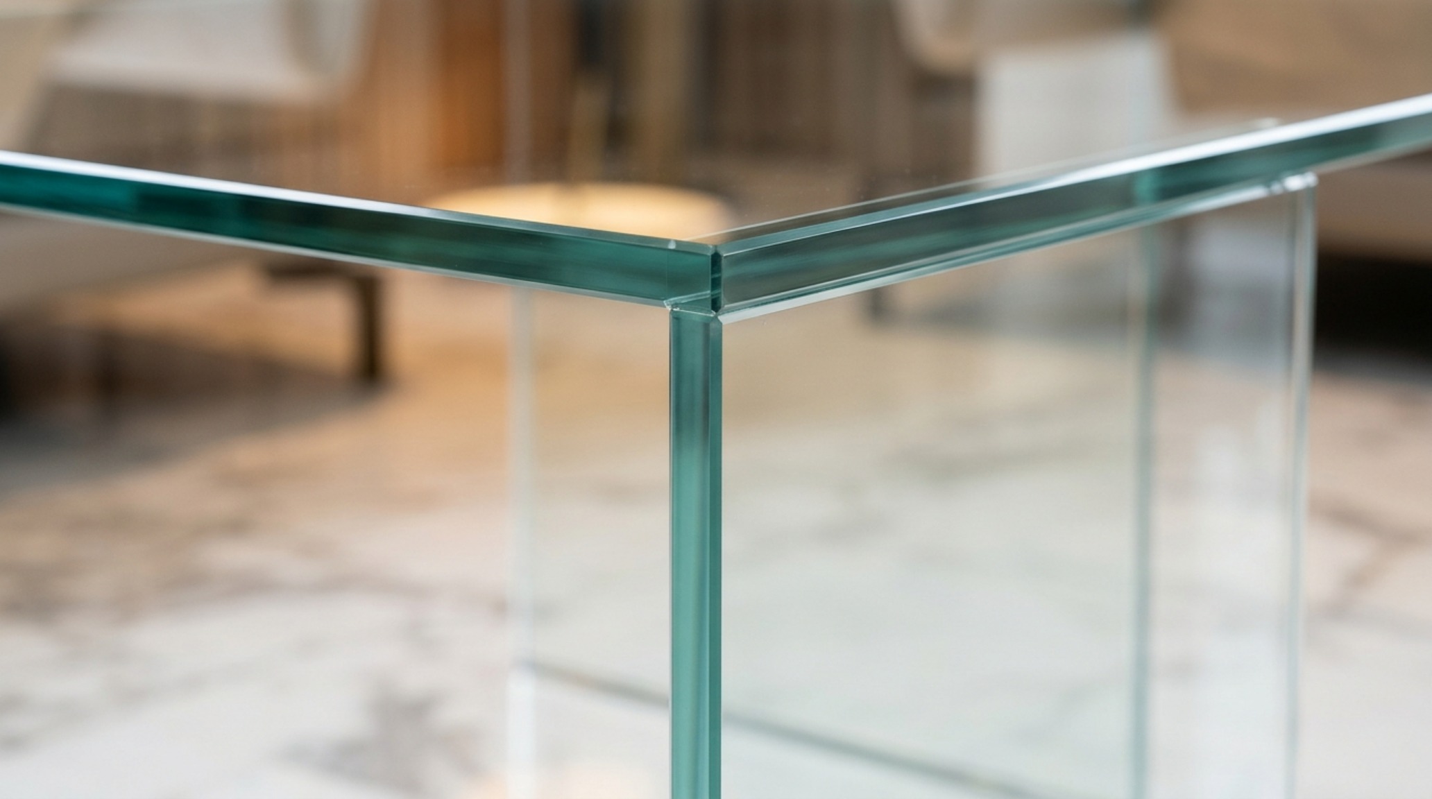 A 12mm architectural tempered glass table with UV-bonded invisible joints, positioned 18 inches from a cream bouclé sofa for ergonomic perfection. A 12mm architectural tempered glass table with UV-bonded invisible joints, positioned 18 inches from a cream bouclé sofa for ergonomic perfection.