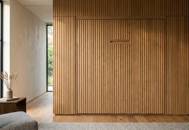 luxury modern wall bed textures featuring fluted white oak panels and integrated brass hardware in a serene bedroom setting