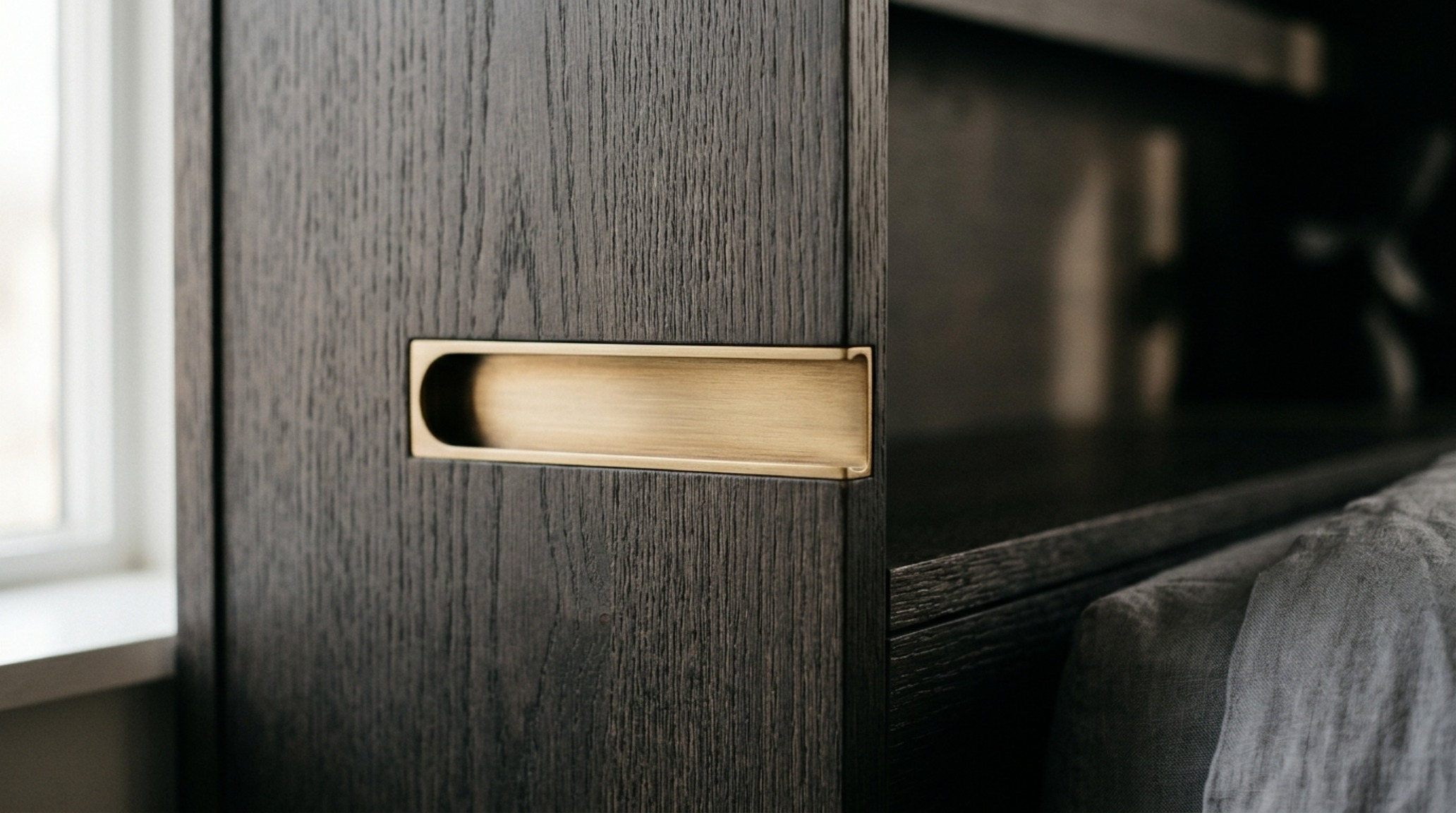 luxury modern wall bed textures close-up highlighting charcoal-stained walnut and matte black architectural hardware