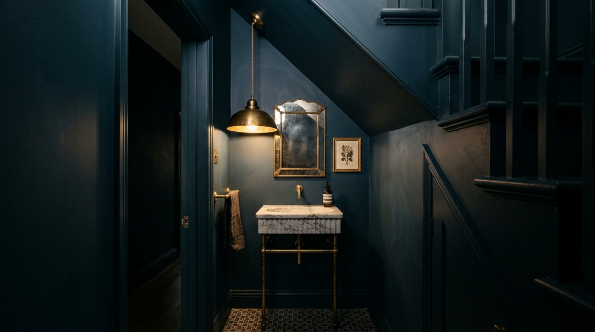 Full-height perspective of a tiny half bath staircase design, illustrating the use of Farrow & Ball Hague Blue on walls and ceiling for a jewel-box effect.