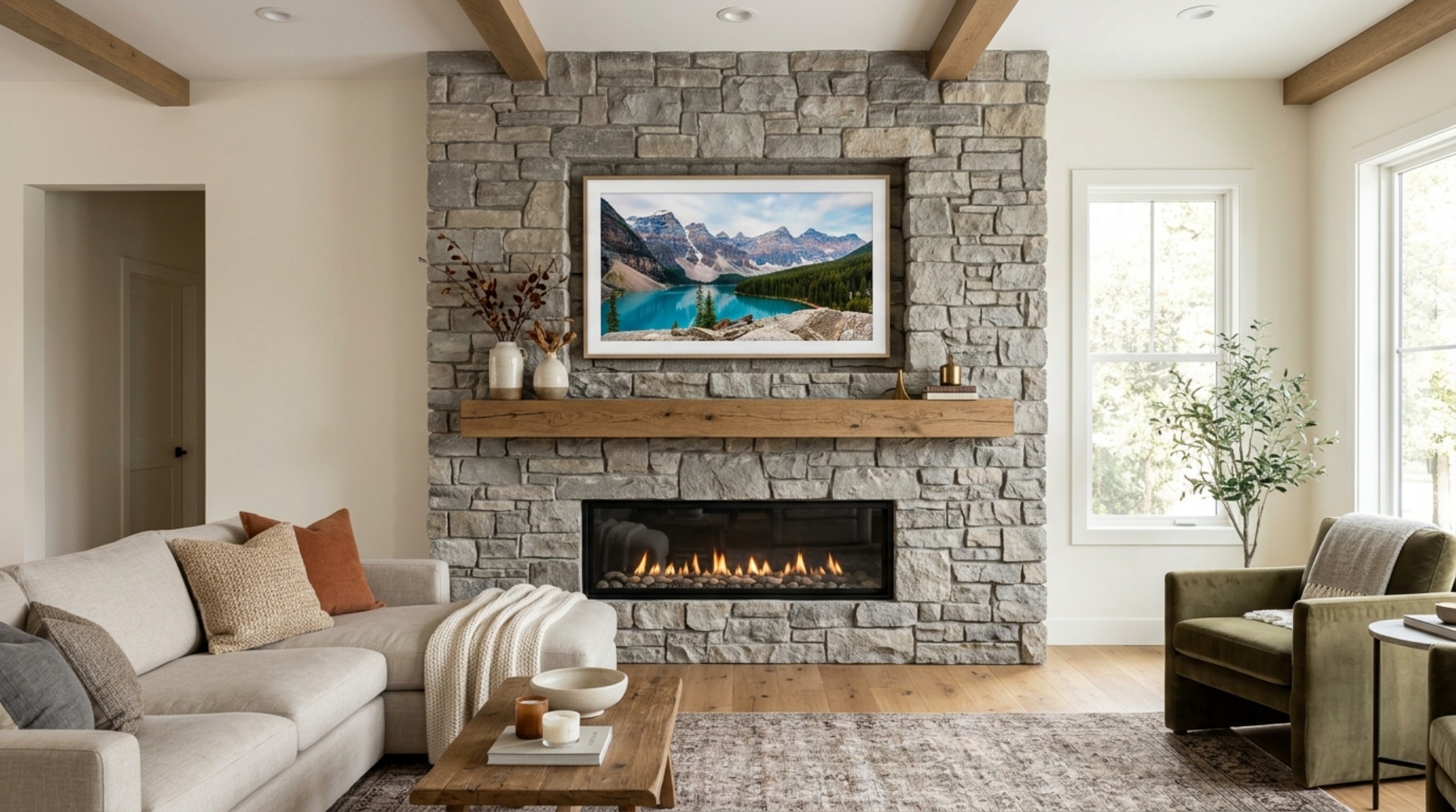 Stone fireplace with integrated TV featuring a seamless mitered niche and textured fossil stone surround in a contemporary living space.
