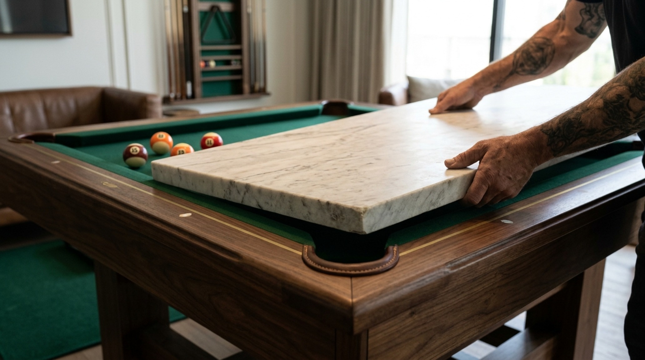 luxury pool dining tables textures highlighting a honed marble dining top resting on a professional billiard slate bed