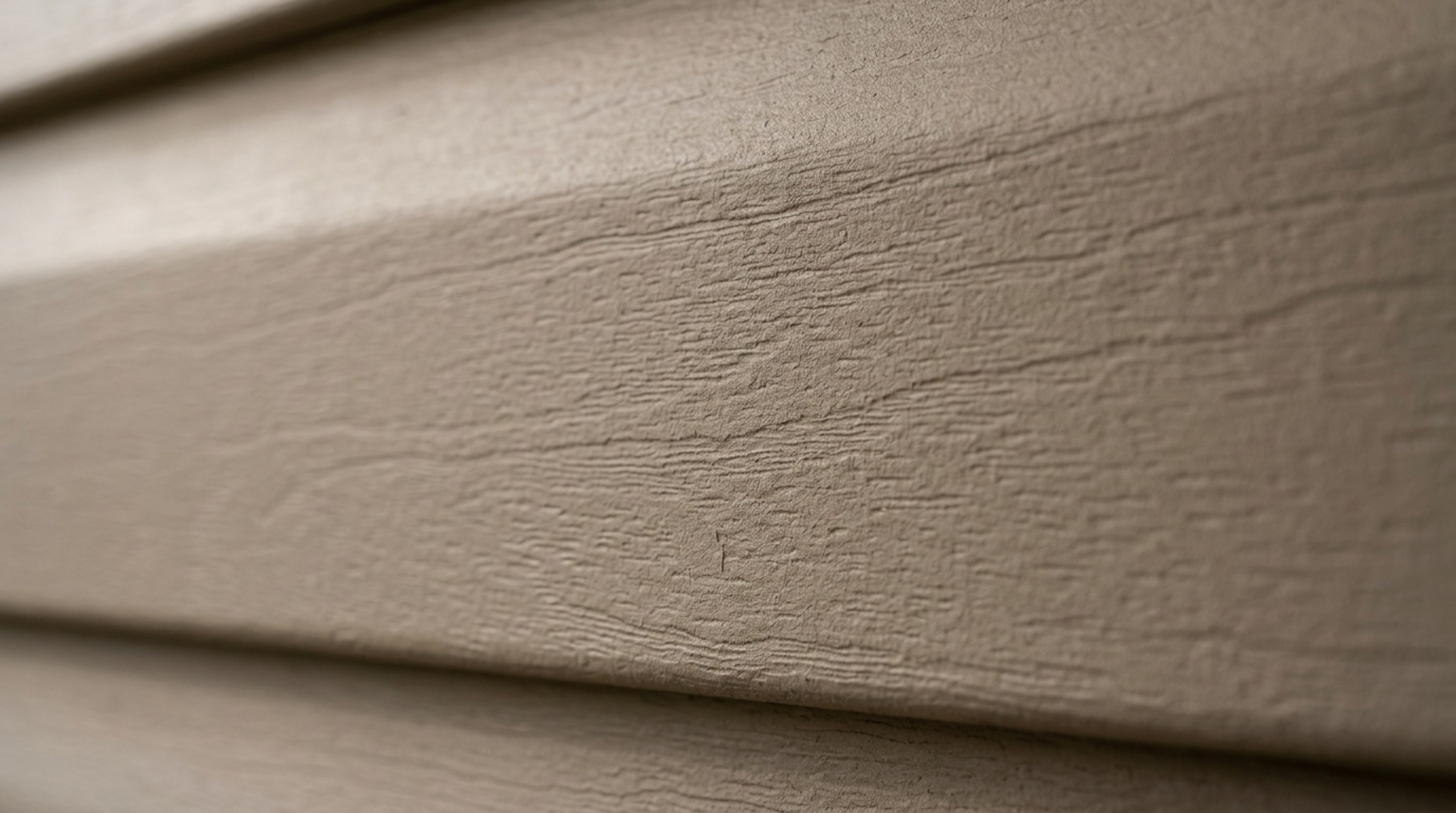 Macro architectural detail of ultra-matte siding texture, showcasing the velvet-like finish and the absence of plastic sheen common in professional vinyl siding painting guide examples.