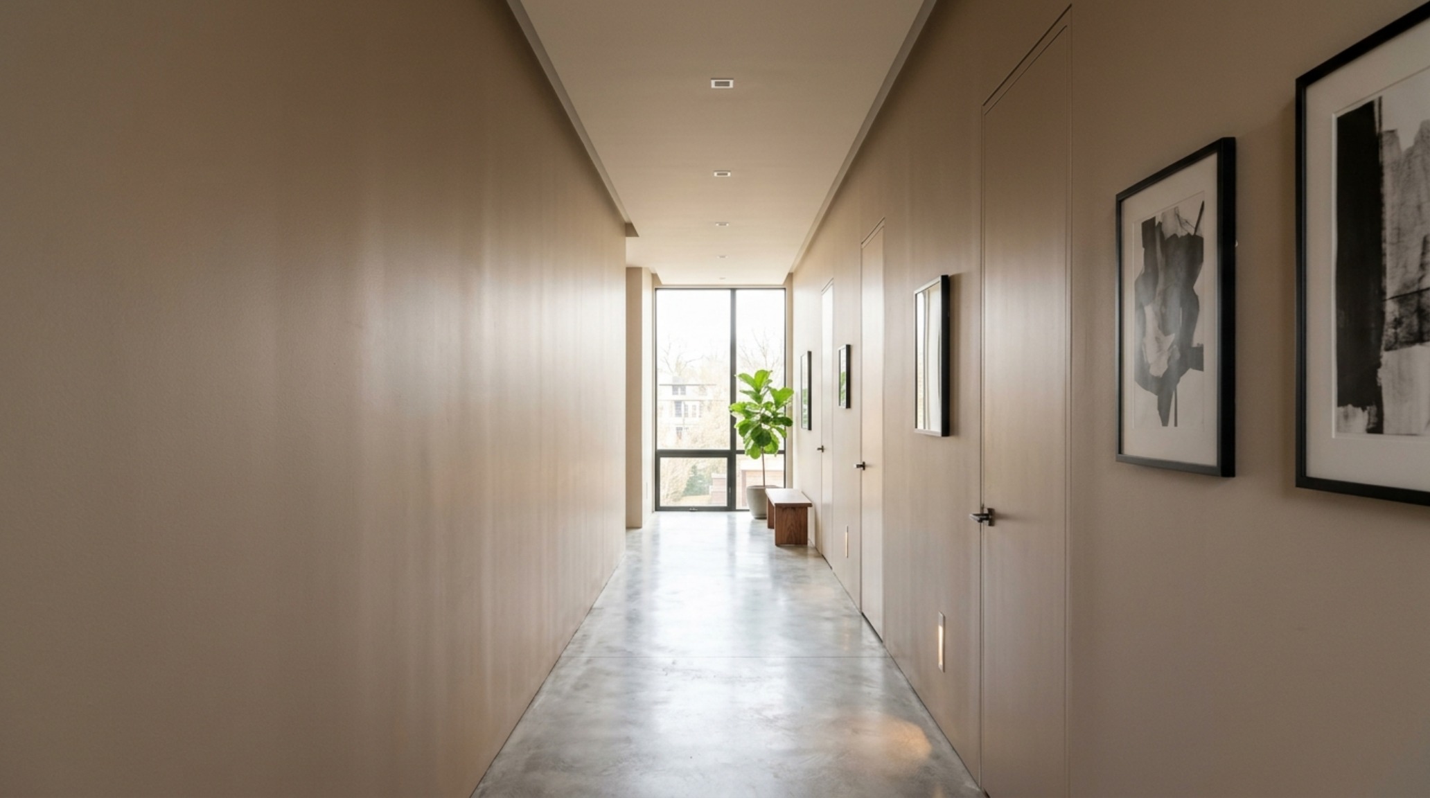 Architectural view of a hallway using shadow play and designer paint secrets to elongate the sightline in a small flat.