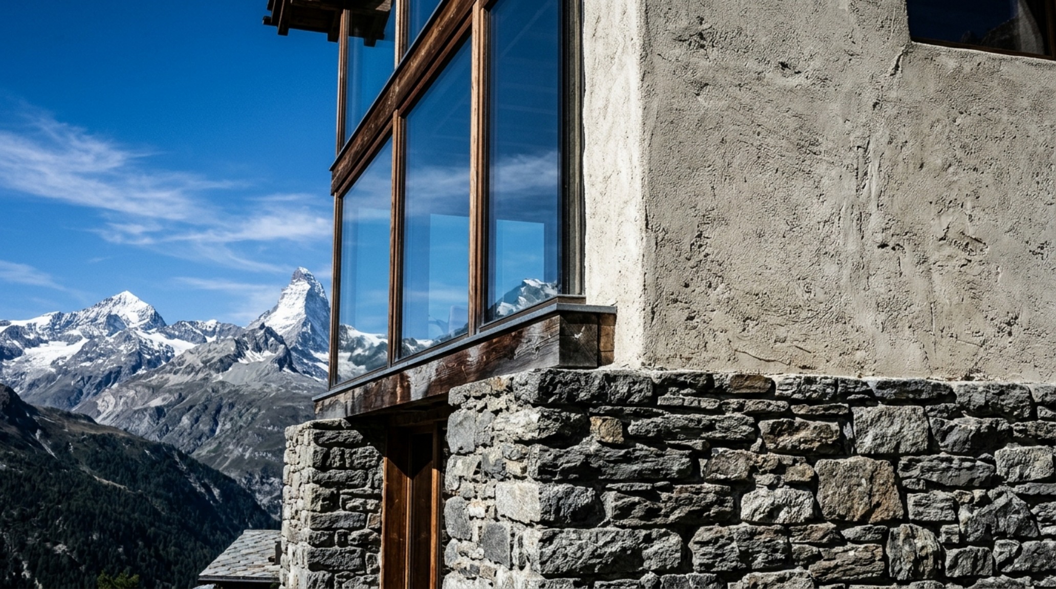 sustainable alpine architecture displaying a gravity-fed stone foundation and lime-plaster exterior at high altitude