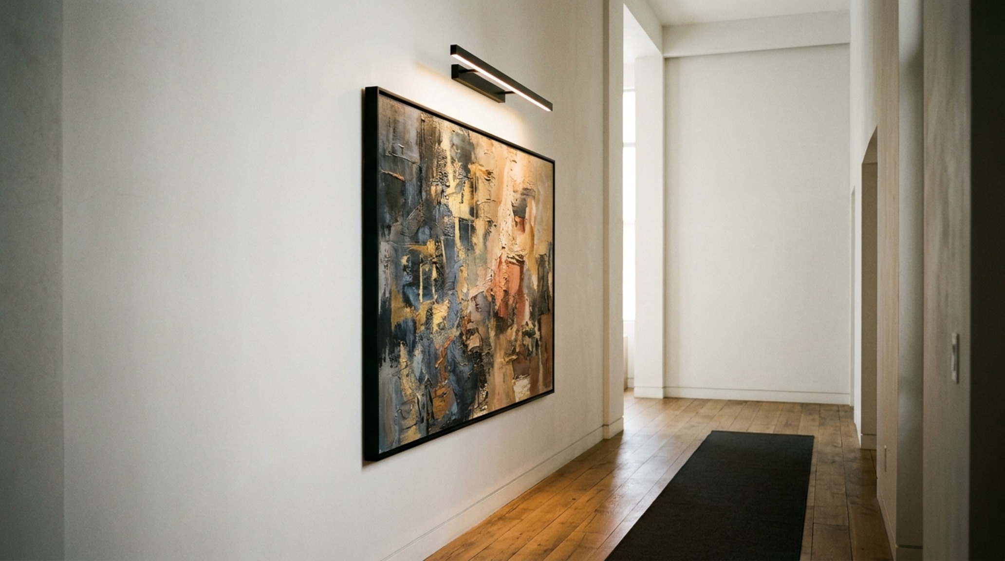 apartment wall decor ideas featuring a large-scale abstract canvas in a minimalist frame with 90+ CRI picture lighting