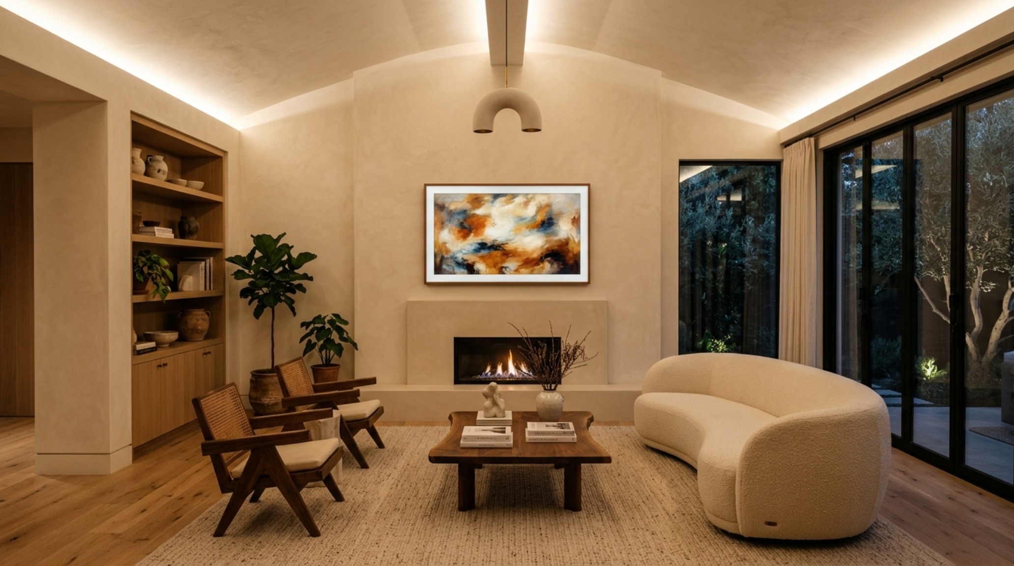 Sophisticated television over fireplace decor ideas featuring a Samsung Frame TV with art on a textured limewash wall and rift-sawn oak mantel. Sophisticated television over fireplace decor ideas featuring a Samsung Frame TV with art on a textured limewash wall and rift-sawn oak mantel.