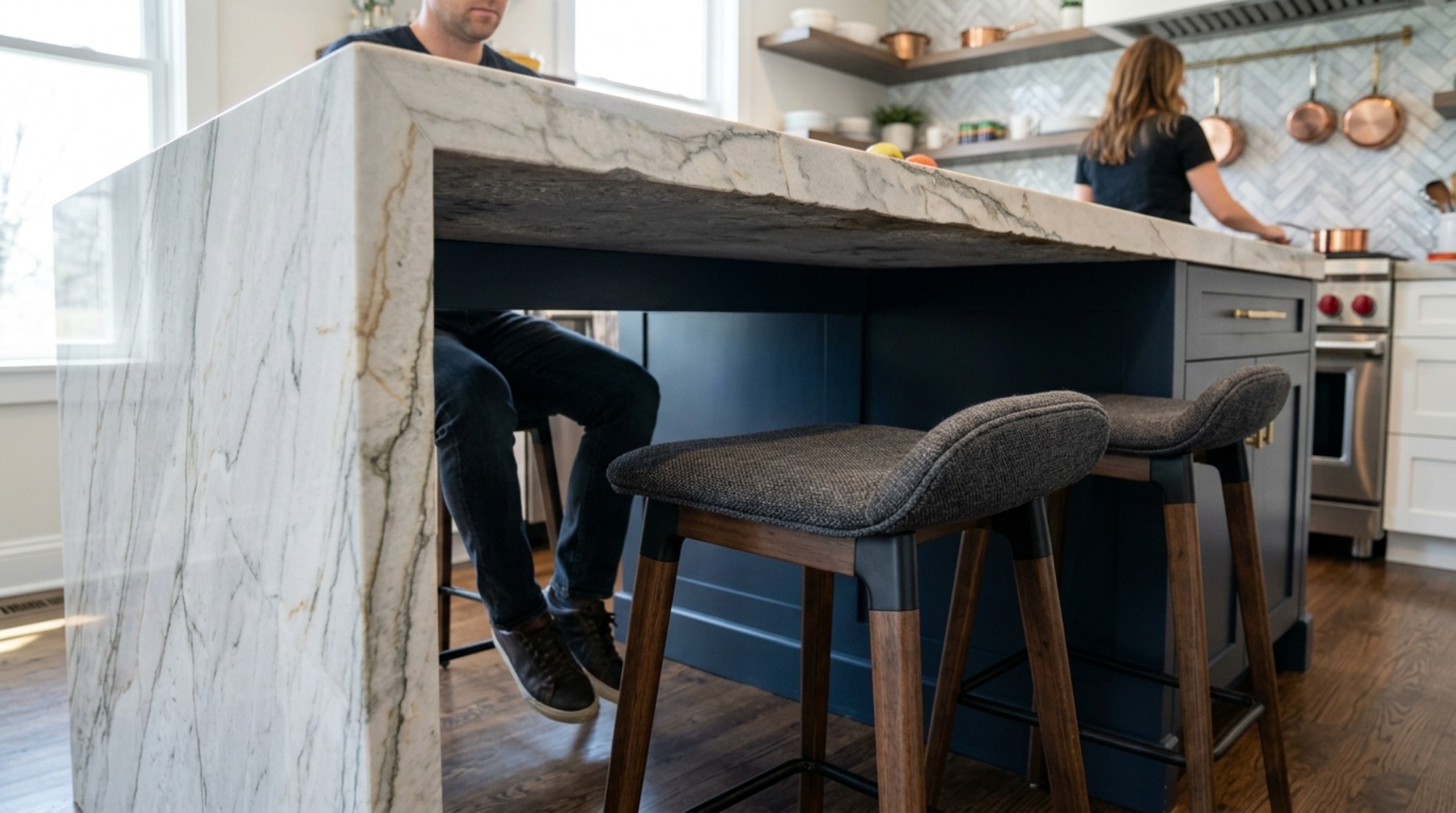 designing kitchen island with seating featuring a 15-inch marble overhang and minimalist leather stools for ergonomic comfort. designing kitchen island with seating featuring a 15-inch marble overhang and minimalist leather stools for ergonomic comfort.