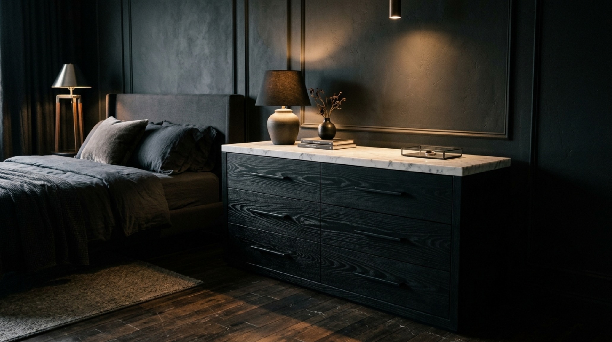 dark wood bedroom furniture set in a moody architectural space with ebonized oak surfaces and matte black hardware accents