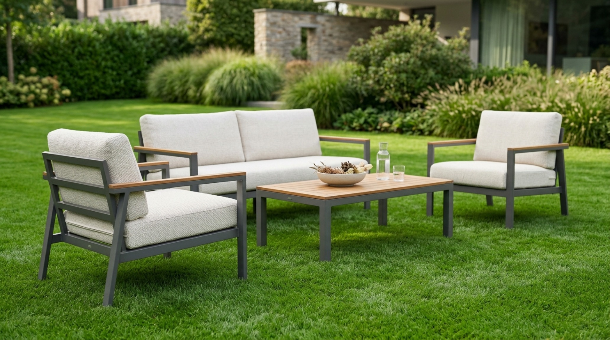 Luxury turf colorant for outdoor living rooms applied to a lawn surrounding a low-slung 18-inch high modular sofa set on a gravel terrace. Luxury turf colorant for outdoor living rooms applied to a lawn surrounding a low-slung 18-inch high modular sofa set on a gravel terrace.