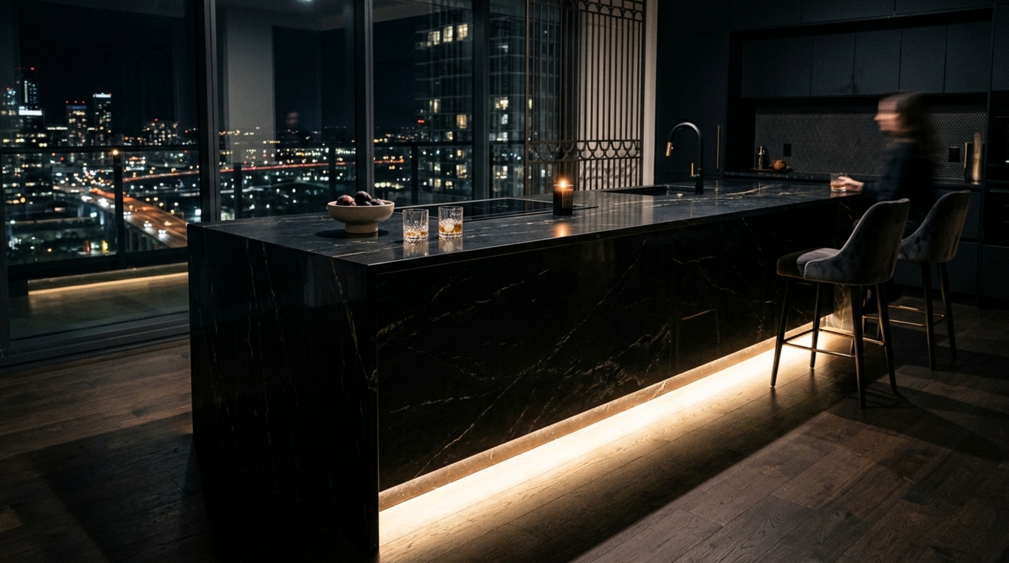 luxury waterfall edge island designs in Nero Marquina marble reflecting soft 2700K ambient lighting luxury waterfall edge island designs in Nero Marquina marble reflecting soft 2700K ambient lighting