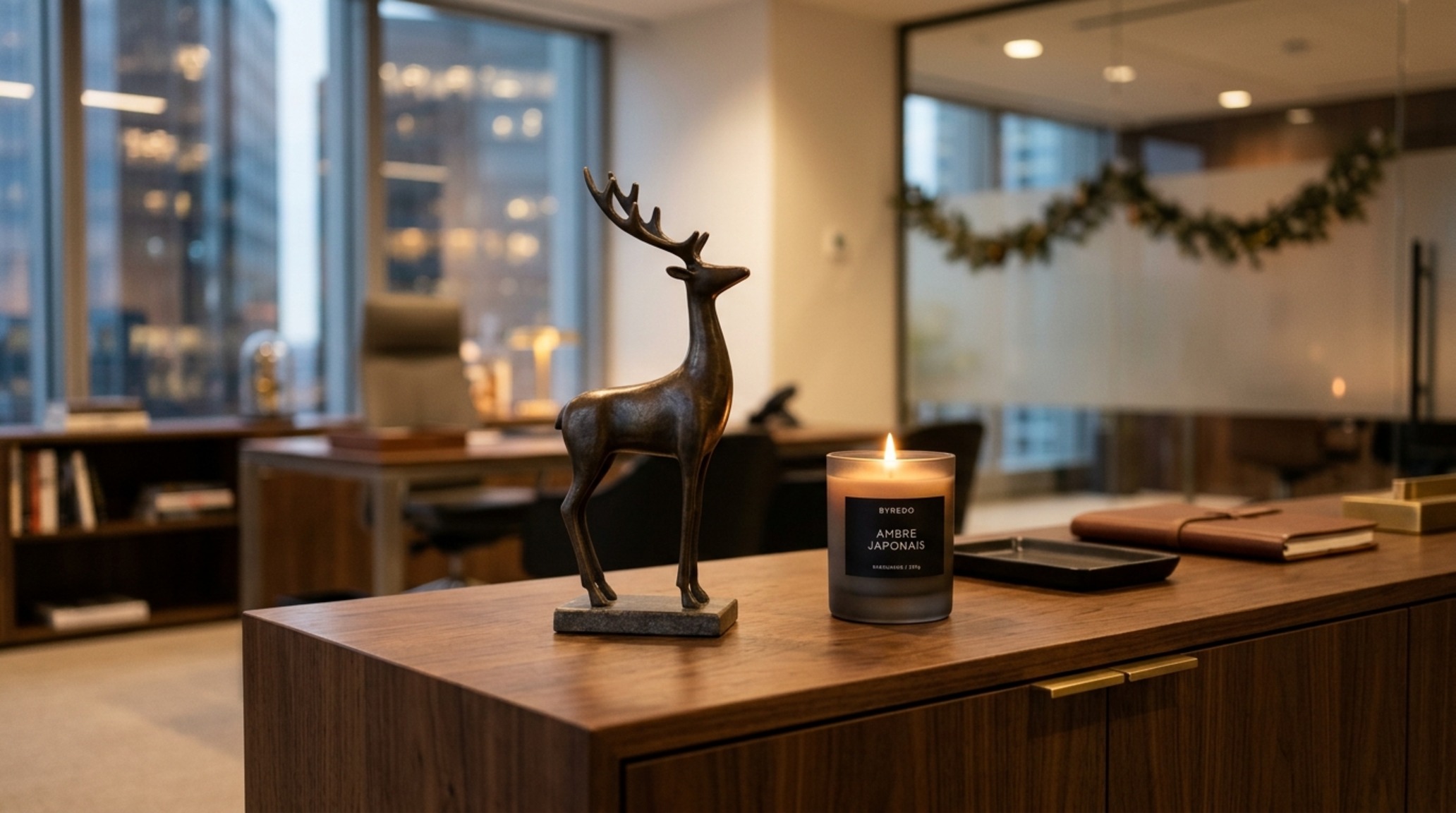 desk christmas decorations professional featuring an elegant bronze reindeer sculpture and a battery-operated 2700K lantern on a dark walnut desk
