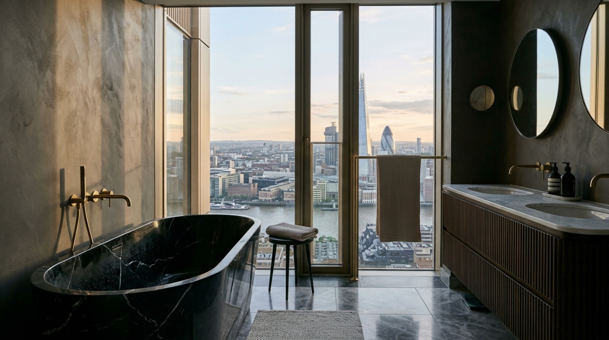 high-end residential spatial planning for a spa-like ensuite bathroom with a freestanding stone tub and panoramic city views through structural fins.