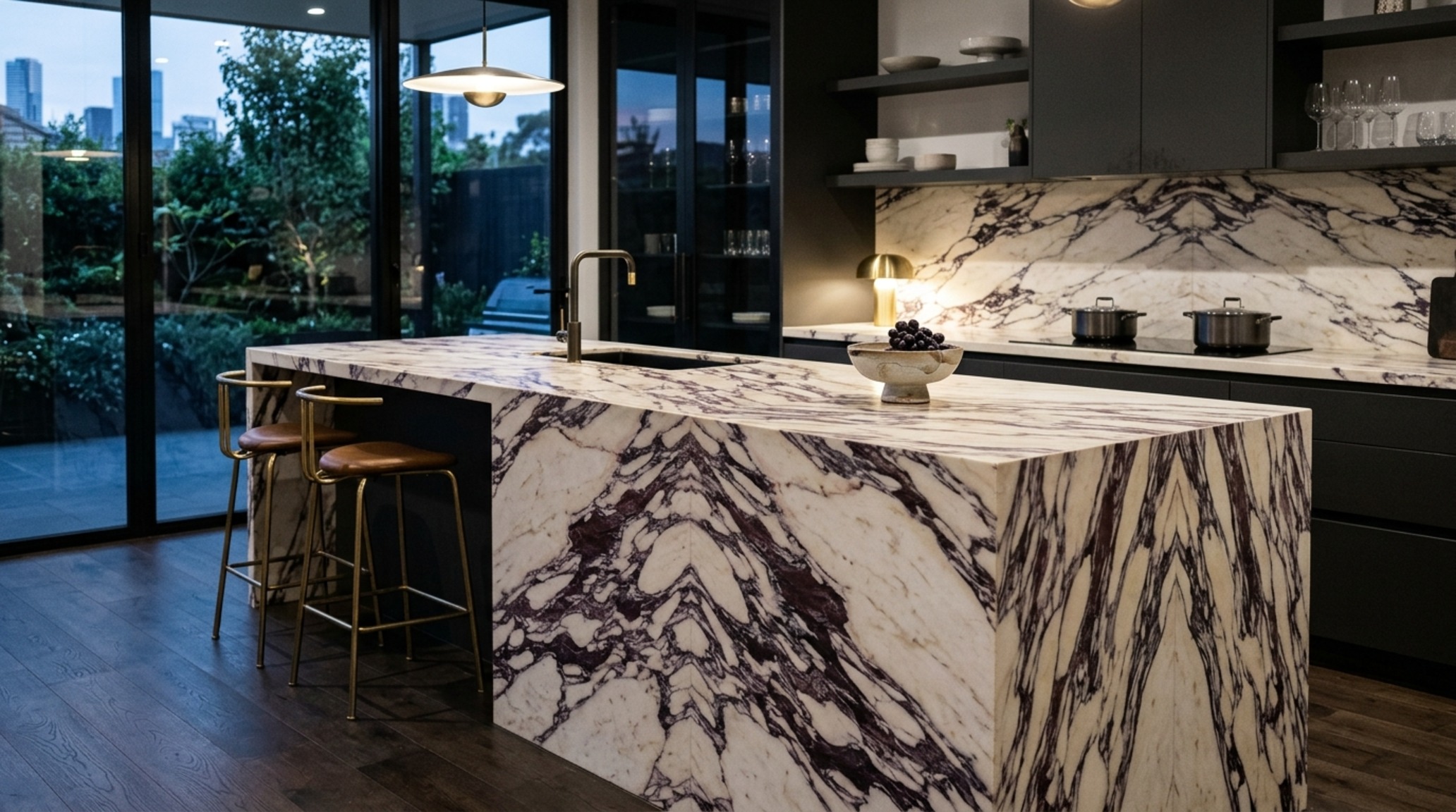 modern waterfall countertop trends in a dramatic Calacatta Viola marble island with matching bookmatched floor detailing.