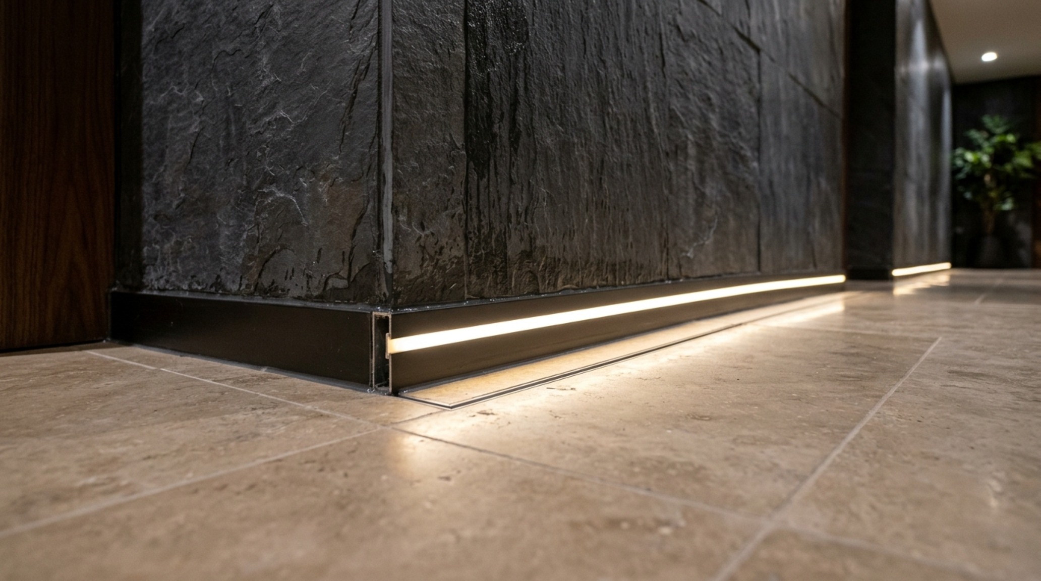 Waterproofing subterranean homes structural view showing the intersection of a polished anthracite concrete floor and a moisture-resistant fluted wood feature wall.