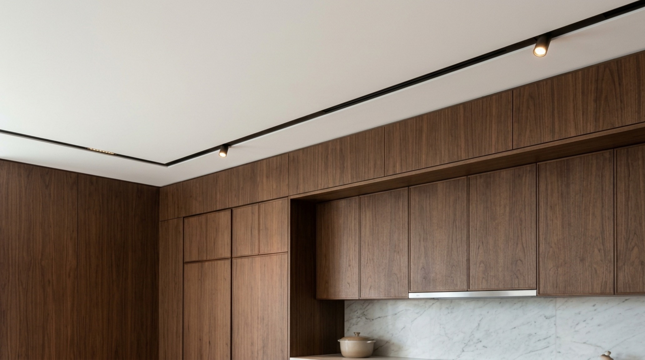 Minimalist kitchen layout ideas emphasizing the geometric precision of ceiling-height cabinetry and shadow-line architectural details. Minimalist kitchen layout ideas emphasizing the geometric precision of ceiling-height cabinetry and shadow-line architectural details.