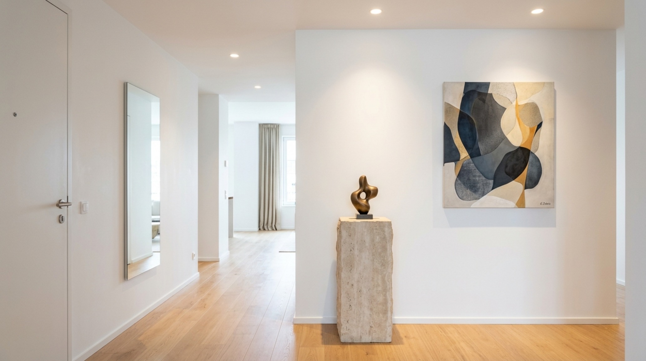 Entryway gallery featuring a single piece of abstract art and a stone plinth, emphasizing negative space and spatial cadence.