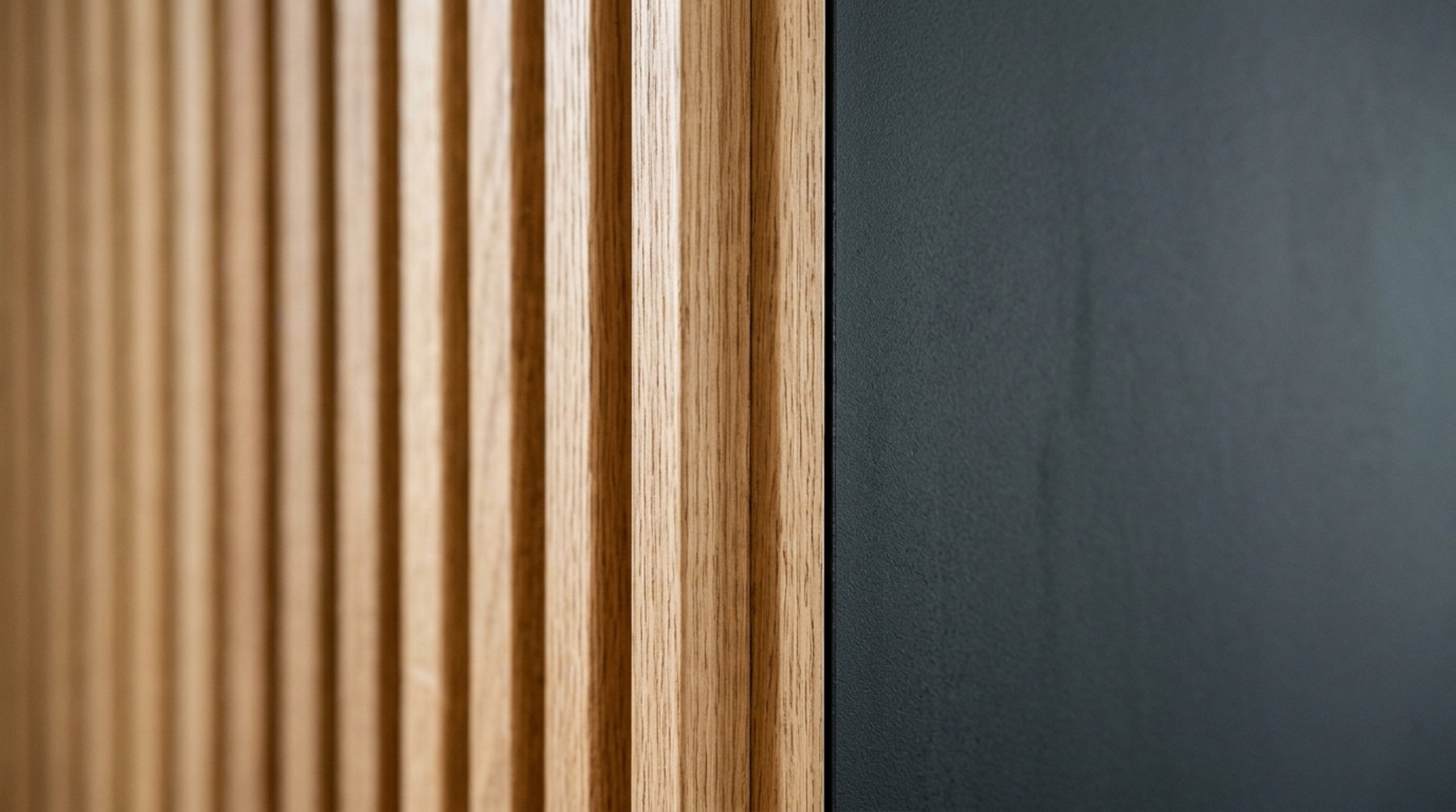 minimalist interior design tips showing a close-up of fluted wood textures meeting a cool slate-colored wall in a high-performance sanctuary minimalist interior design tips showing a close-up of fluted wood textures meeting a cool slate-colored wall in a high-performance sanctuary