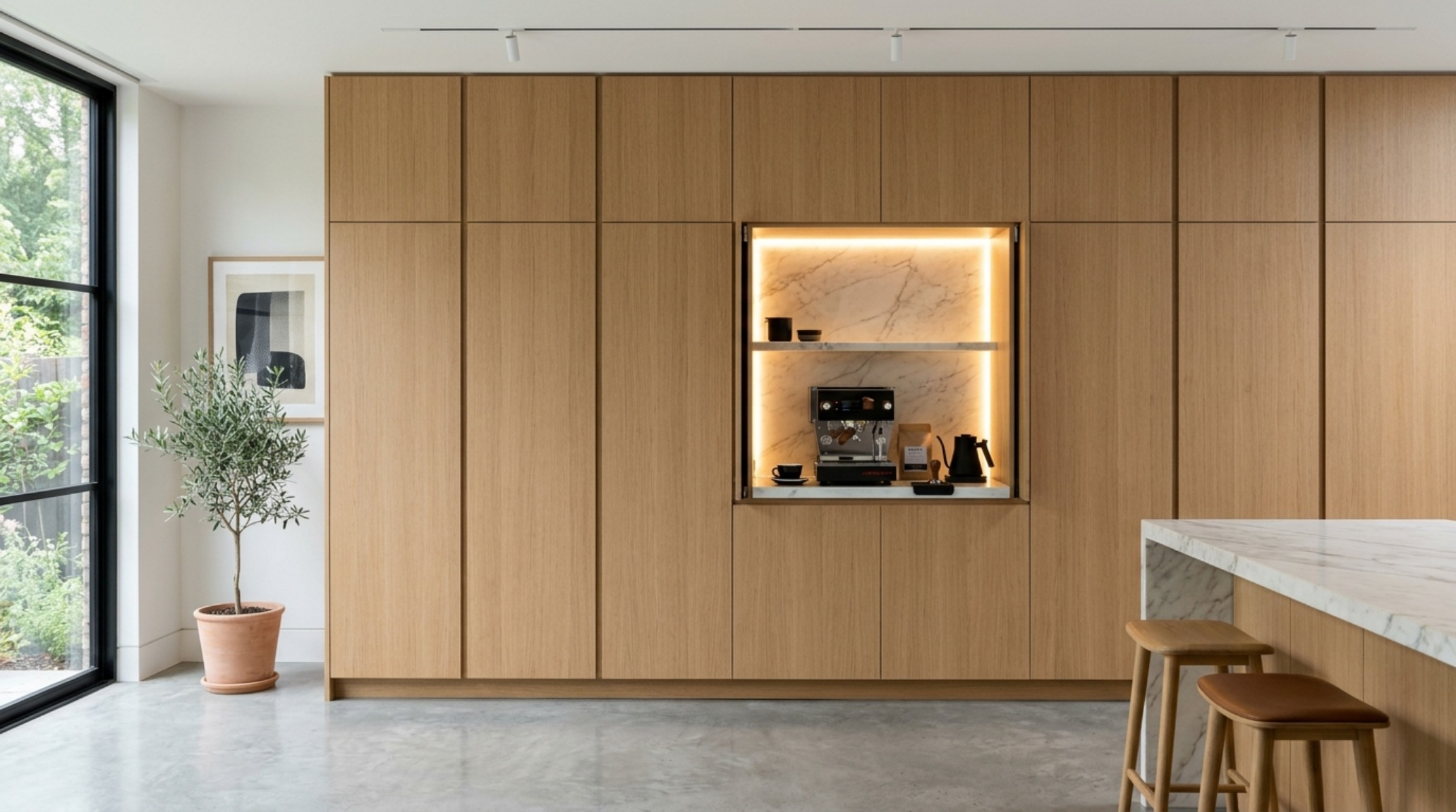 small space storage solutions using bespoke floor-to-ceiling oak cabinetry with integrated touch-latch hardware and shadow gap detailing