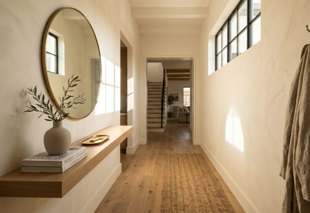 A sun-drenched narrow entryway featuring limewash walls in Benjamin Moore Swiss Coffee and a minimalist floating oak console for narrow entryway ideas.