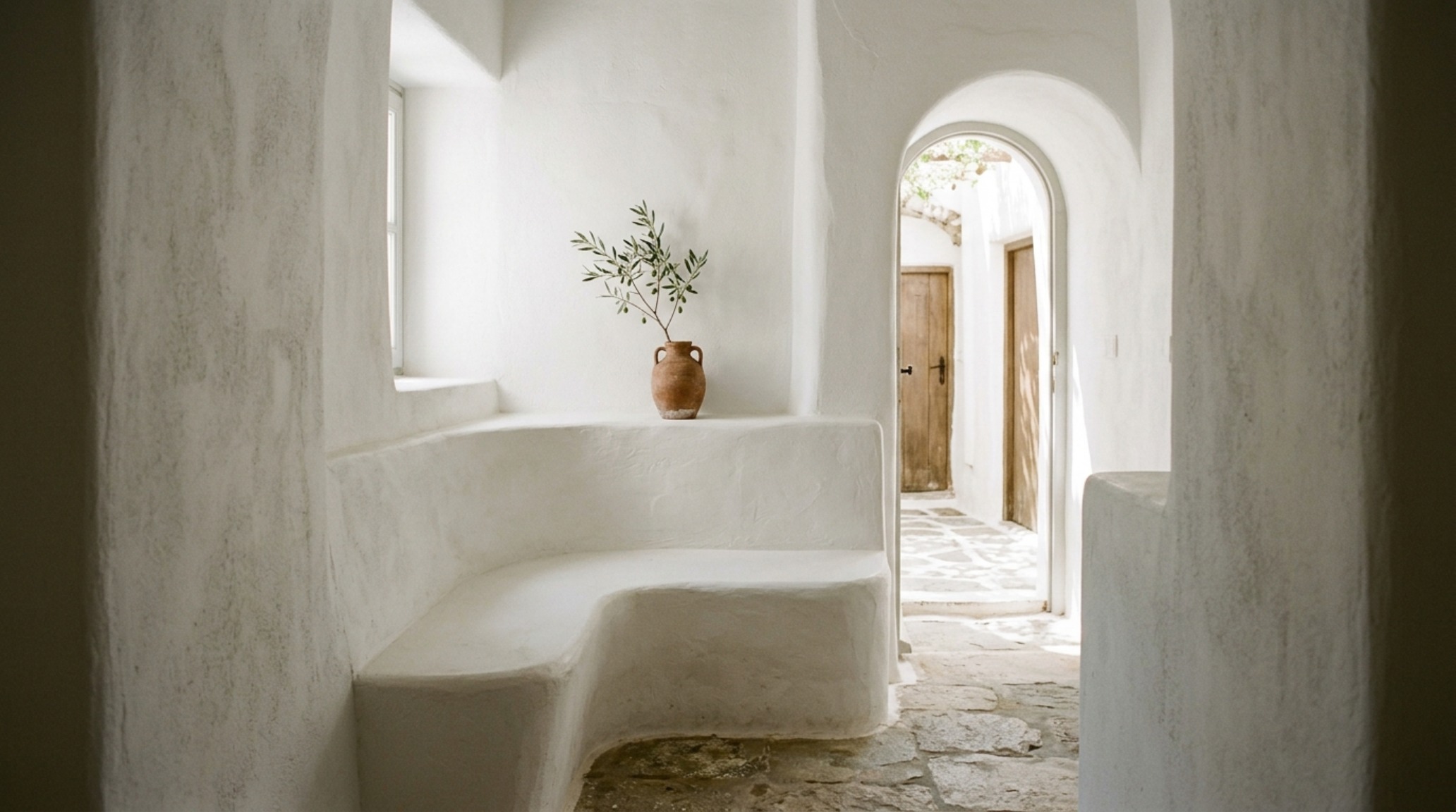 Small space greek architecture in modern buildings featuring a custom-built oak bench and minimalist alcove shelving for optimal spatial cadence. Small space greek architecture in modern buildings featuring a custom-built oak bench and minimalist alcove shelving for optimal spatial cadence.