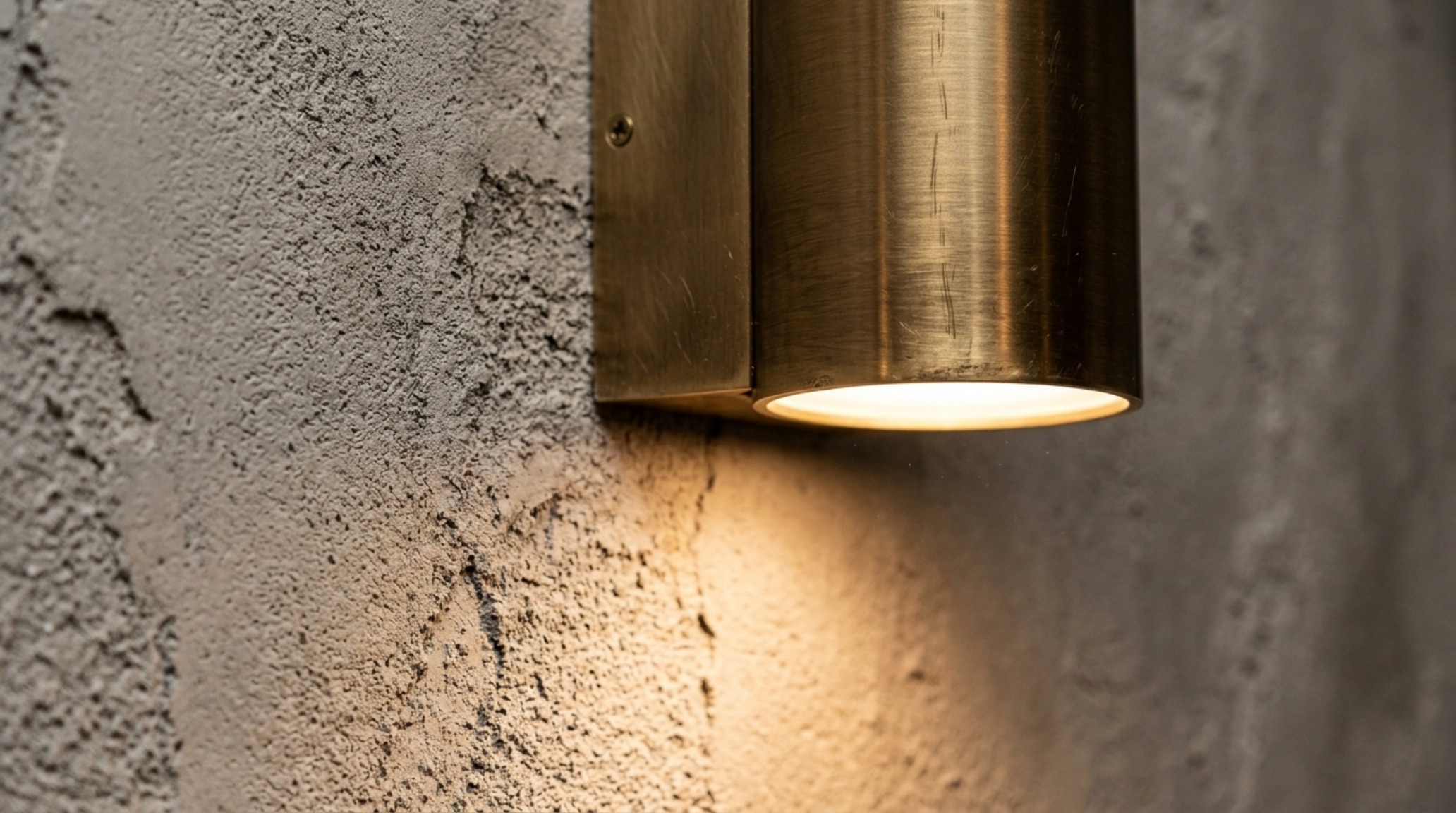 Luxury greige paint decor ideas textures featuring a close-up of a limewash greige wall paired with a brushed brass sconce and organic linen upholstery. Luxury greige paint decor ideas textures featuring a close-up of a limewash greige wall paired with a brushed brass sconce and organic linen upholstery.