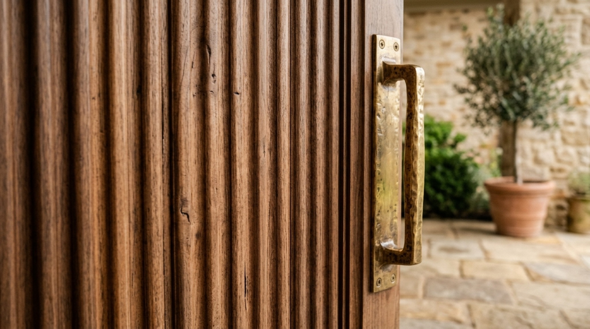 luxury ideas for front doors textures highlighting a fluted walnut door panel with an unlacquered brass designer handle luxury ideas for front doors textures highlighting a fluted walnut door panel with an unlacquered brass designer handle