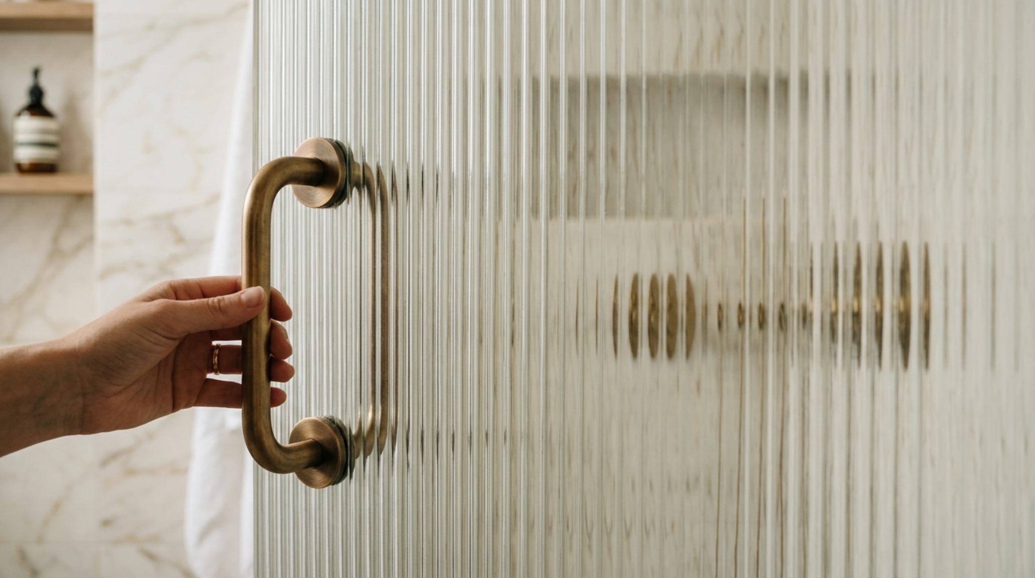 luxury ideas for small bathrooms textures with a close-up on ribbed glass shower doors and brushed bronze hardware details. luxury ideas for small bathrooms textures with a close-up on ribbed glass shower doors and brushed bronze hardware details.