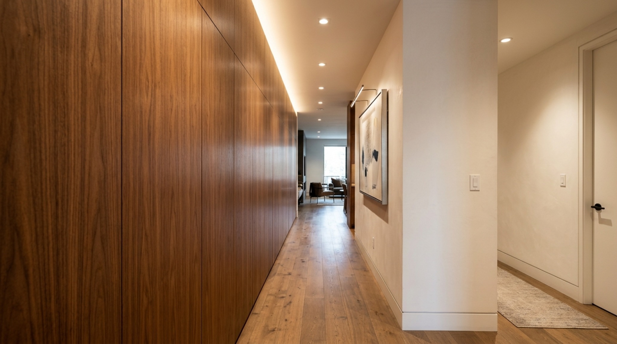 small space million dollar home designs utilizing custom floor-to-ceiling walnut joinery to maximize storage in a luxury urban loft small space million dollar home designs utilizing custom floor-to-ceiling walnut joinery to maximize storage in a luxury urban loft