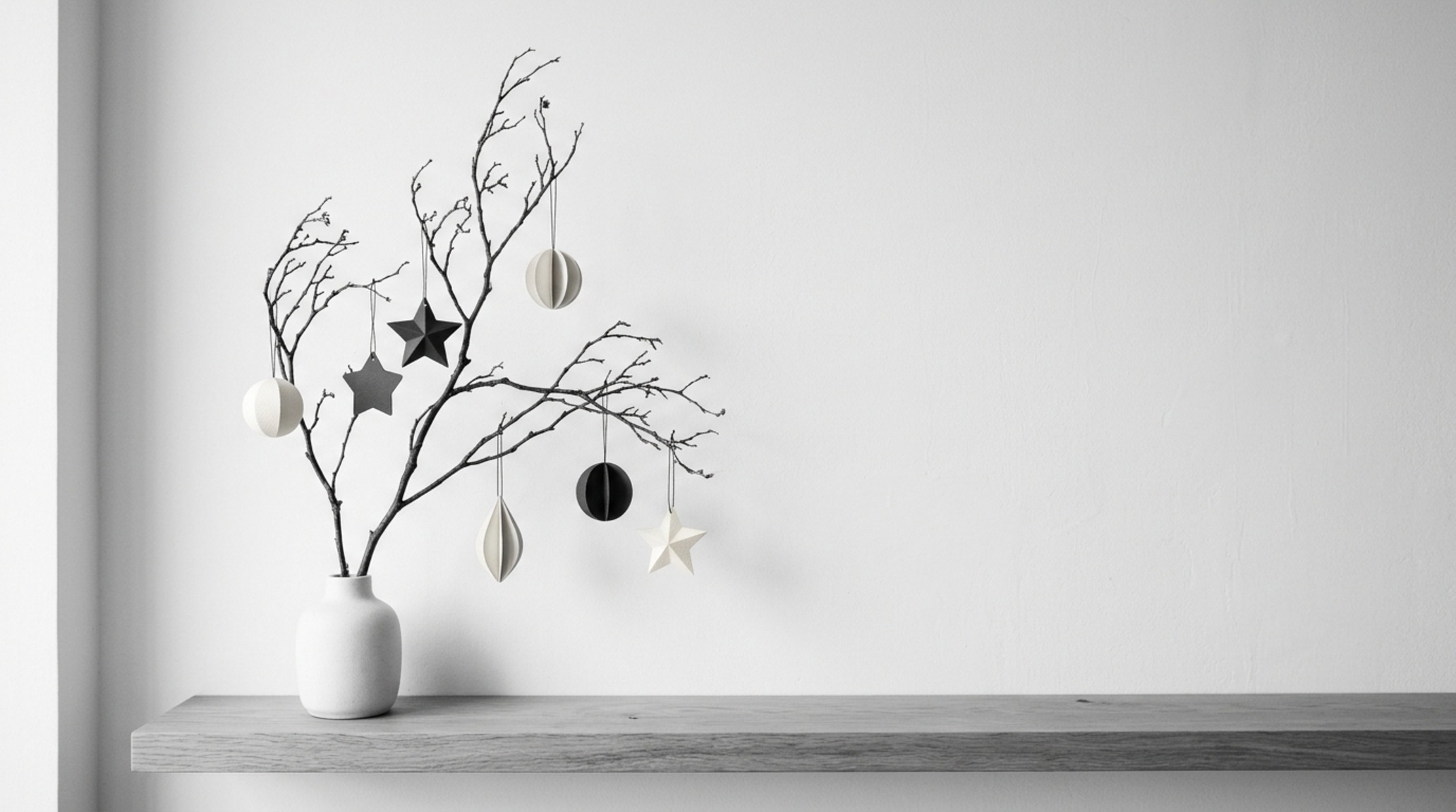 modern new christmas decorating ideas ideas focusing on a monochrome palette of sand and charcoal ornaments on a sparse spruce branch