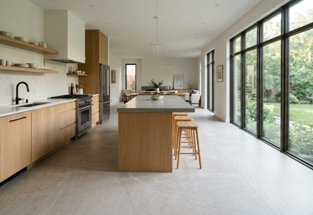 modern tile designs for kitchen floors ideas featuring oversized greige porcelain tiles with rectified edges in a sun-drenched minimalist kitchen.
