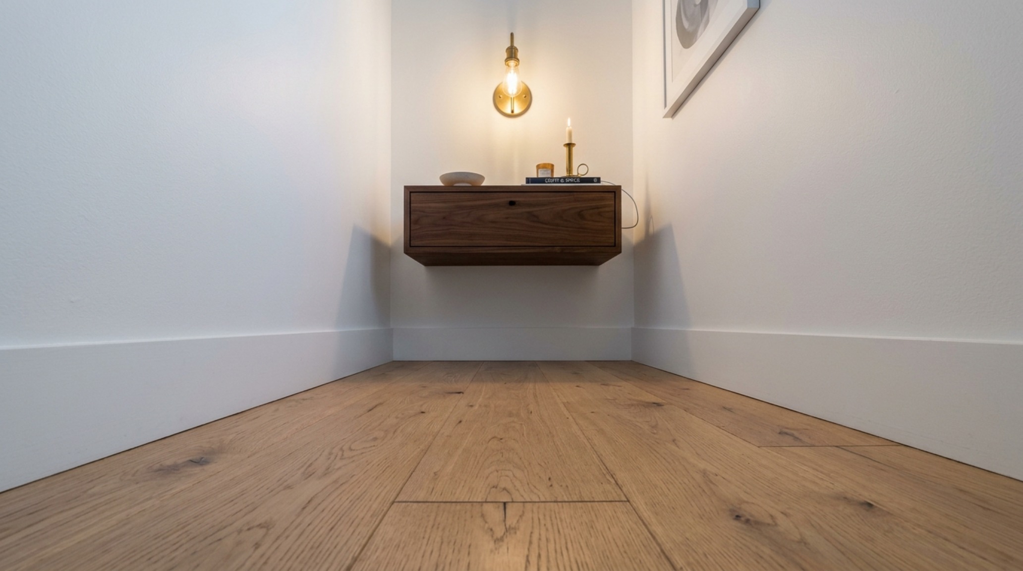 Architectural view of a master suite where wall-mounted bedroom furniture creates a sense of weightlessness, emphasizing floor-to-ceiling spatial flow. Architectural view of a master suite where wall-mounted bedroom furniture creates a sense of weightlessness, emphasizing floor-to-ceiling spatial flow.