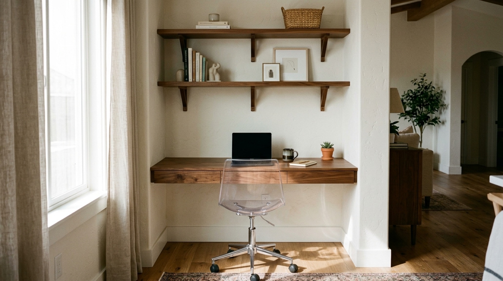 small space trendy office decor utilizing a wall-mounted floating desk to maximize floor plane visibility and 36-inch walkway clearance