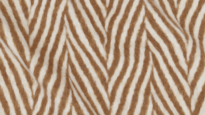 Close up shot of textured wool herringbone fabric in camel and cream.