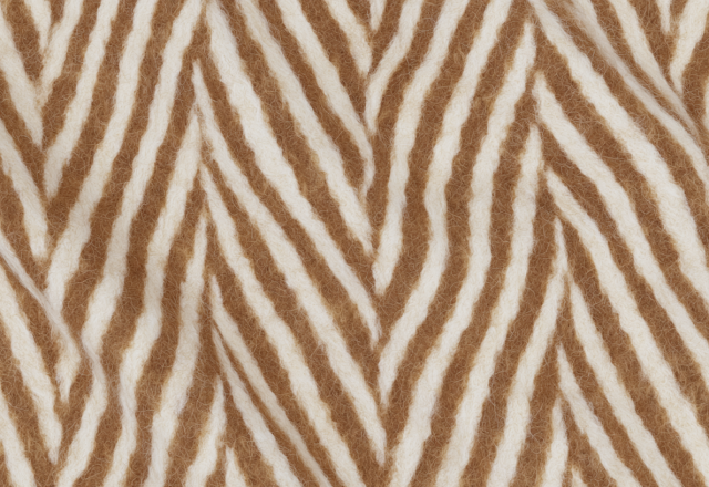 Close up shot of textured wool herringbone fabric in camel and cream.