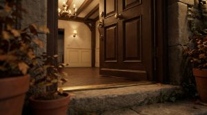 Open wooden front entryway door revealing a warm foyer with hardwood floors and brass hardware.